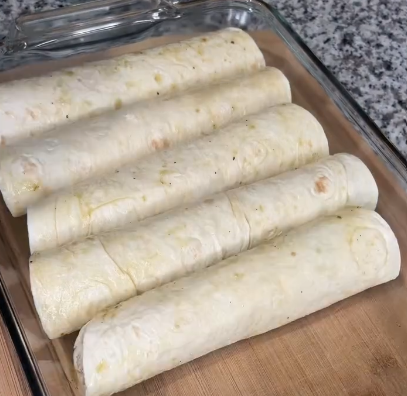 Step 2.1: Roll tortillas and place seam-side down in the baking dish