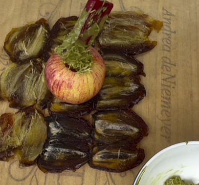 Step 1.2: Flatten the dates and wrap them around each apple to create a natural caramel layer