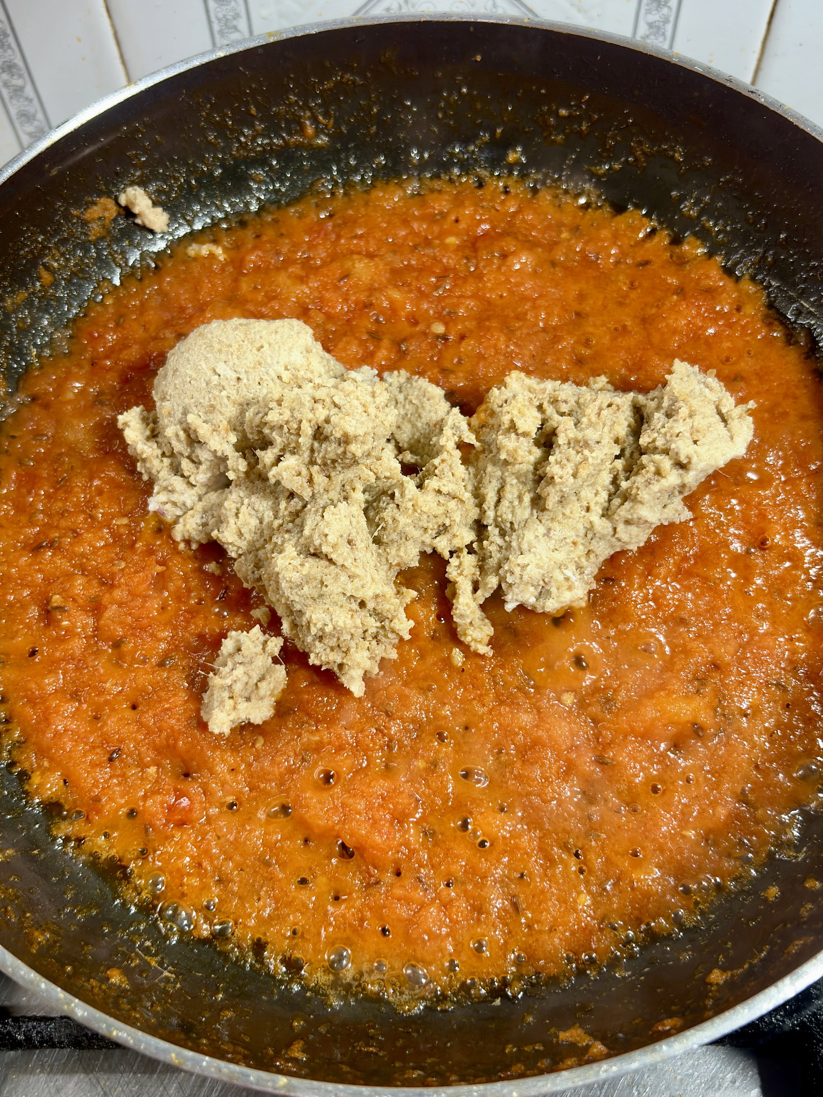 Step 4.1: Add the prepared barista paste and ½ cup of hot water to the pan