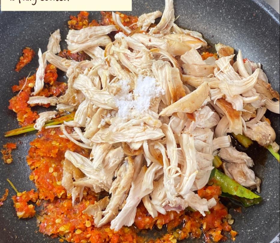 Step 1.1: Add the shredded chicken, seasoning (salt, mushroom bouillon, white pepper), and a splash of water