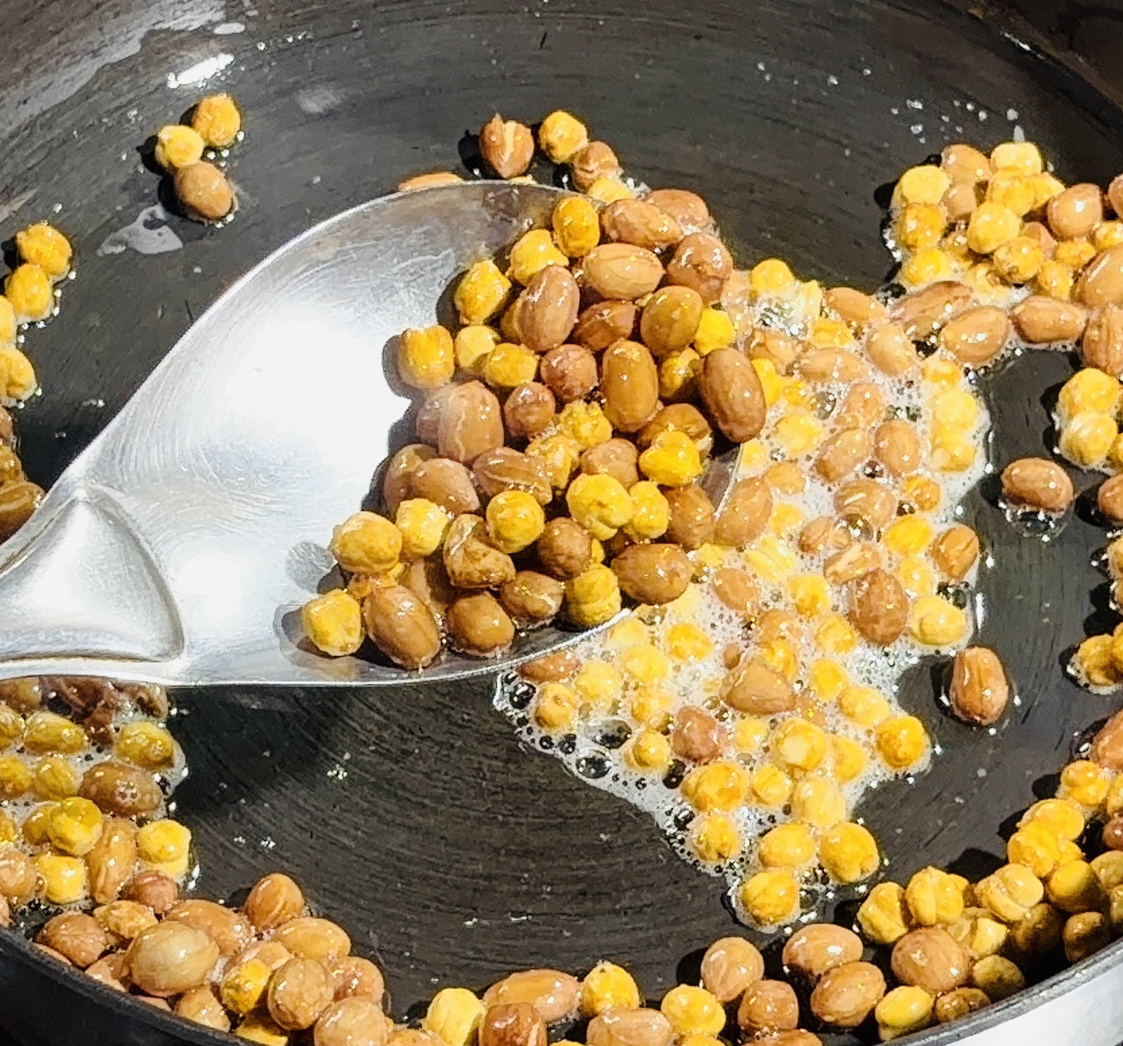 Step 2.1: Stir in the roasted chana dal and sauté for 30 seconds until slightly crisp
