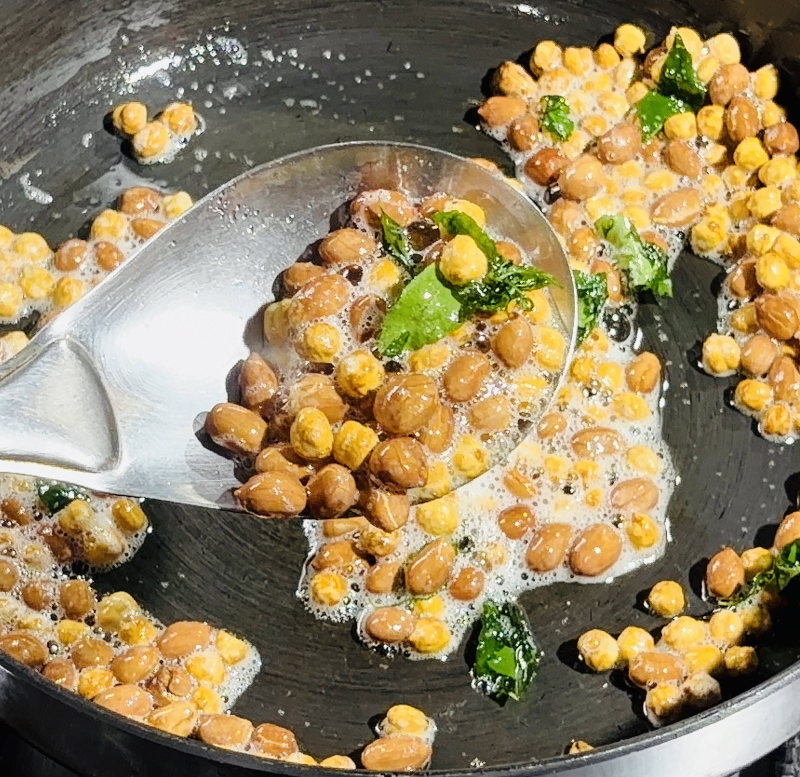 Step 2.1: Toss in the curry leaves and fry until they become completely crisp
