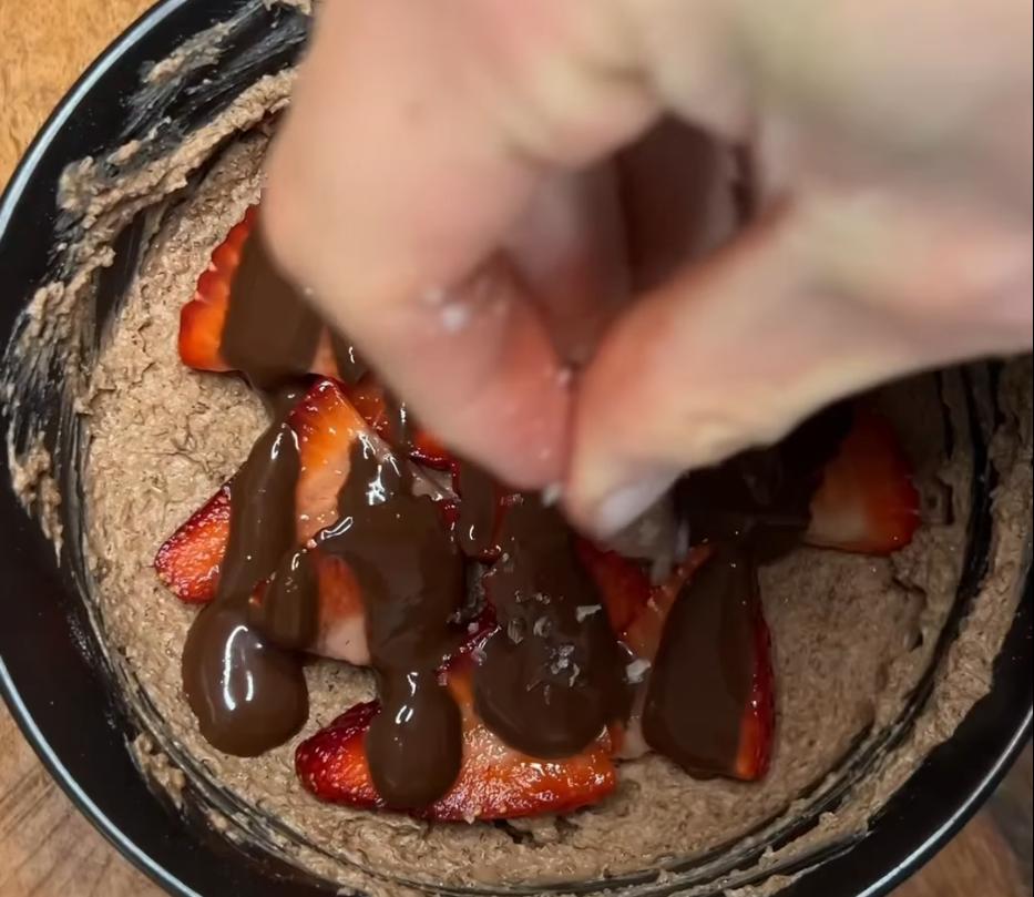 Step 1.1: Top the pudding with the chocolate fudge sauce, sliced strawberries or fruit of choice, and a pinch of flakey sea salt