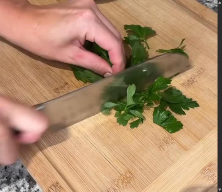 Step 2.1: Melt butter in a microwave-safe bowl and mix in fresh parsley and garlic