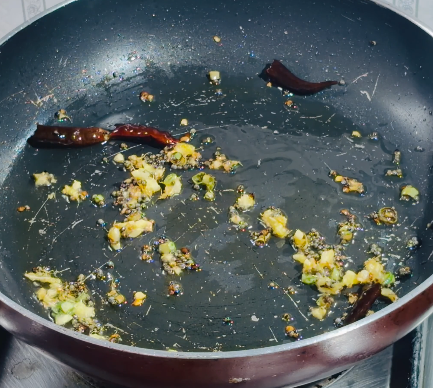 Step 1.1: Stir in ginger and green chilli; cook for about a minute