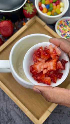 Step 2.1: Add finely chopped strawberries and stir gently to combine