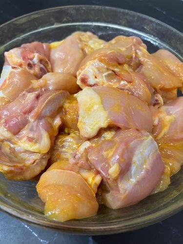 Step 1.1: Clean 1 kg of chicken thoroughly by rubbing with salt and fresh lemon juice