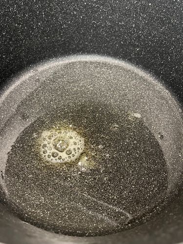 Step 3.2: In a heavy-bottomed kadai or deep pan, heat oil and butter