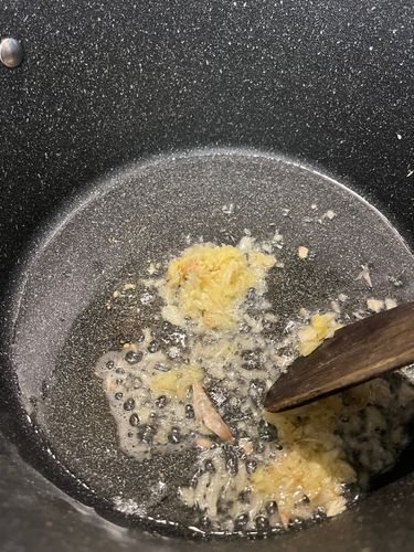 Step 3.3: Once the butter melts, add freshly ground ginger-garlic paste and sauté until the raw smell disappears