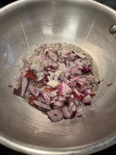 Step 2.1: Add finely sliced onions and fry on medium flame until golden brown for caramelization