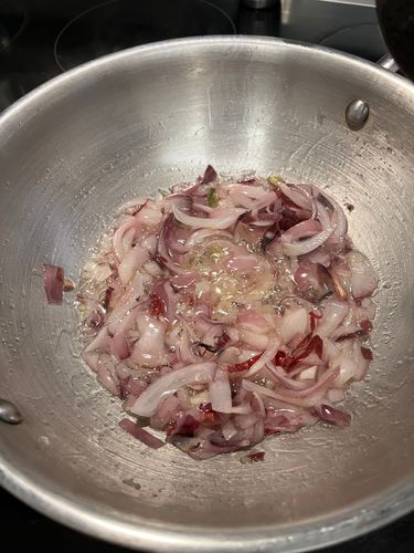 Step 2.2: Add finely sliced onions and fry on medium flame until golden brown for caramelization