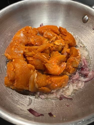 Step 3.1: Increase the flame to high and add the marinated chicken to the pan