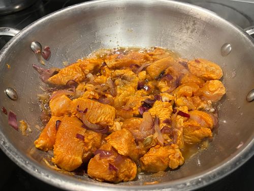 Step 3.1: As the chicken releases water, continue to fry until the moisture dries up and oil separates
