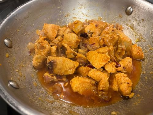 Step 3.2: As the chicken releases water, continue to fry until the moisture dries up and oil separates