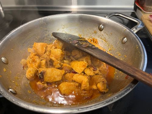 Step 3.1: Once the oil floats, reduce the flame to low and cover the pan