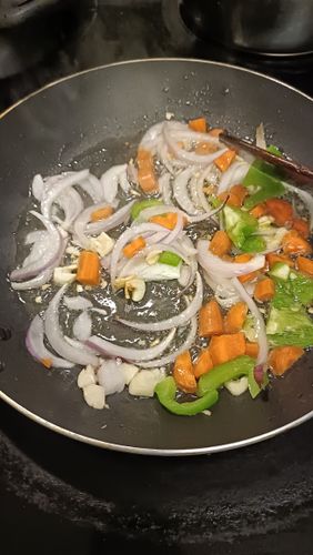 Step 2.1: Add cubed onions, chopped carrots, capsicum, and sweet corn