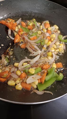Step 2.2: Add cubed onions, chopped carrots, capsicum, and sweet corn