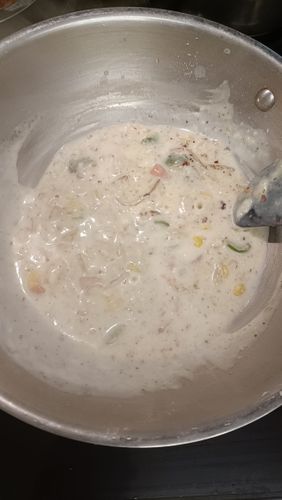 Step 3.2: Slowly add 1 cup of milk while stirring to avoid lumps