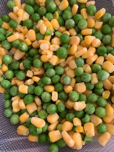 Step 2.1: Pulse the corn, peas, and garlic in a food processor until coarsely ground—avoid making a fine paste