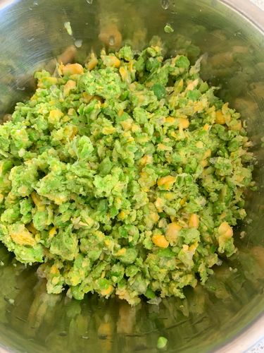 Step 2.2: Pulse the corn, peas, and garlic in a food processor until coarsely ground—avoid making a fine paste