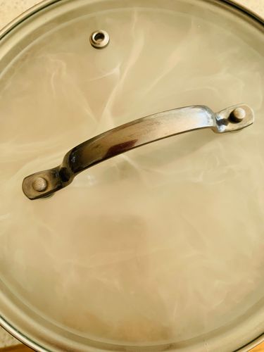 Step 2.2: Heat a piece of coal until red hot, place it on the foil, drizzle with a teaspoon of oil, and immediately cover the bowl with a tight lid