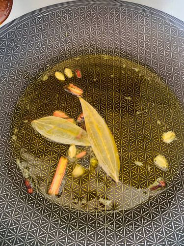 Step 4.1: Add cinnamon, cardamom, cloves, and bay leaves