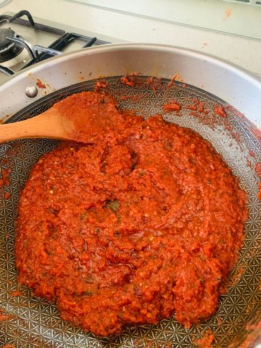 Step 4.1: Cook the masala until it thickens and the oil begins to ooze out or separate from the sides of the pan