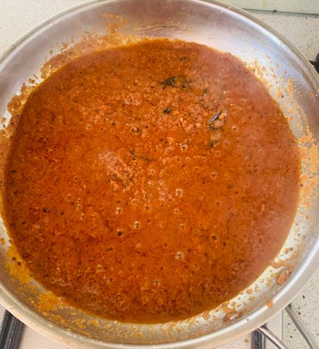 Step 6.1: Now add the onion-tomato puree, along with ¼ cup of water, and salt