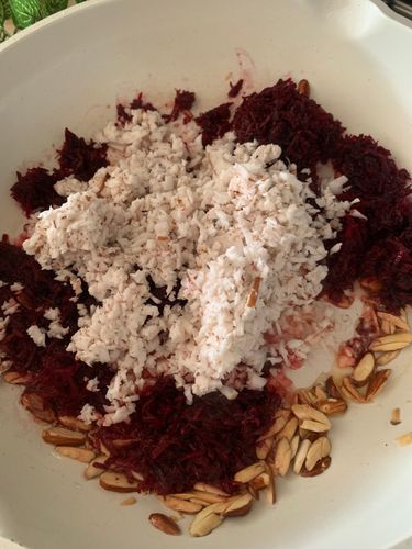 Step 1.1: Add the grated beetroot and coconut to the pan