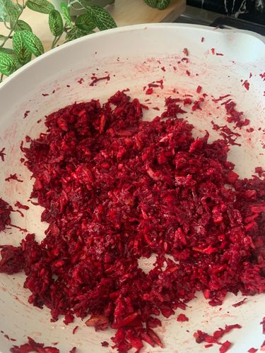 Step 1.2: Add the grated beetroot and coconut to the pan