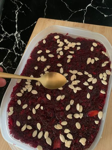 Step 1.1: Garnish with melon seeds or slivered almonds, pressing them gently into the surface