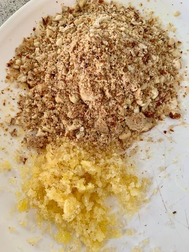 Step 3.1: Once cooled, coarsely grind the puffed gond and roasted almonds together