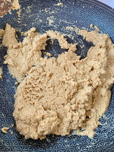 Step 4.2: In the same pan, add the whole wheat flour (atta) and semolina (sooji)
