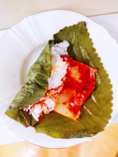 Step 1.1: Add a piece of Baechu-kimchi beside or on top of the rice