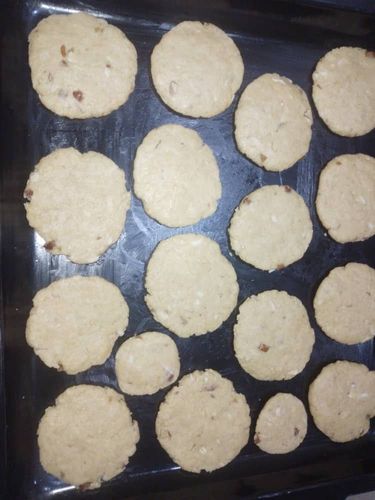 Step 2.1: Flatten each ball and place them on a baking tray